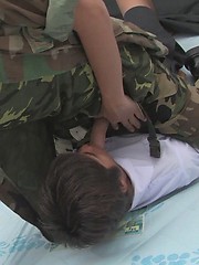 The soldier's prisoner sucks his guards cock, before before having his man hole filled with military cock.