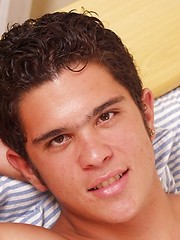 Hot Latin stud with nice uncut cock shoots his load on his stomach.