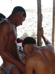 Sexy black twinks fucking bareback on the beach.