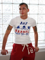 Athletic boy Eric strokes his thick hard cock.