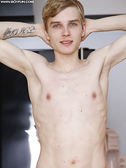 Skinny dude Julian Caro strokes his beautiful cock.