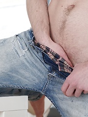 Sexy boy Julian Caro strokes his cock while fingering his ass.